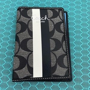 Authentic Coach Passport Holder. Black & white Coach pattern with blue interior.